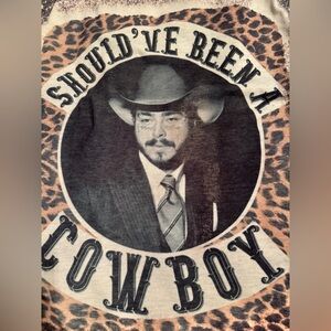 T-Shirt Should’ve Been a Cowboy.  Worn maybe twice. Smoke free, pet free home.